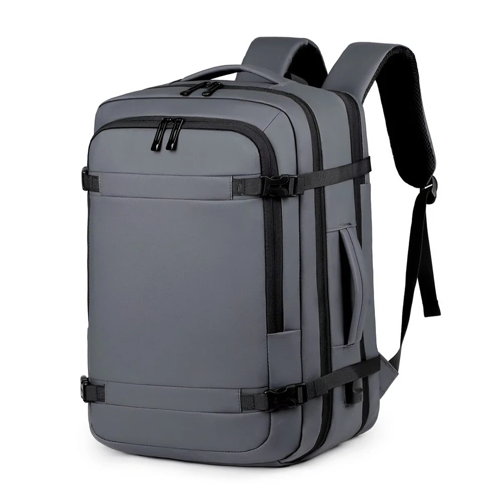 A gray expandable travel backpack designed for carrying a laptop and gear.
