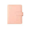 A light pink RFID-blocking travel passport organizer with a card slot and a flap closure.