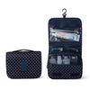 A dark blue multi-compartment travel pouch with a floral print and a hanging loop.
