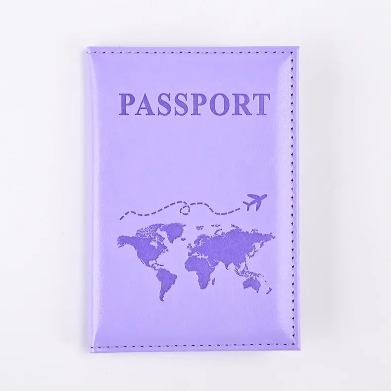 A purple leather passport holder with the word PASSPORT and a world map design.
