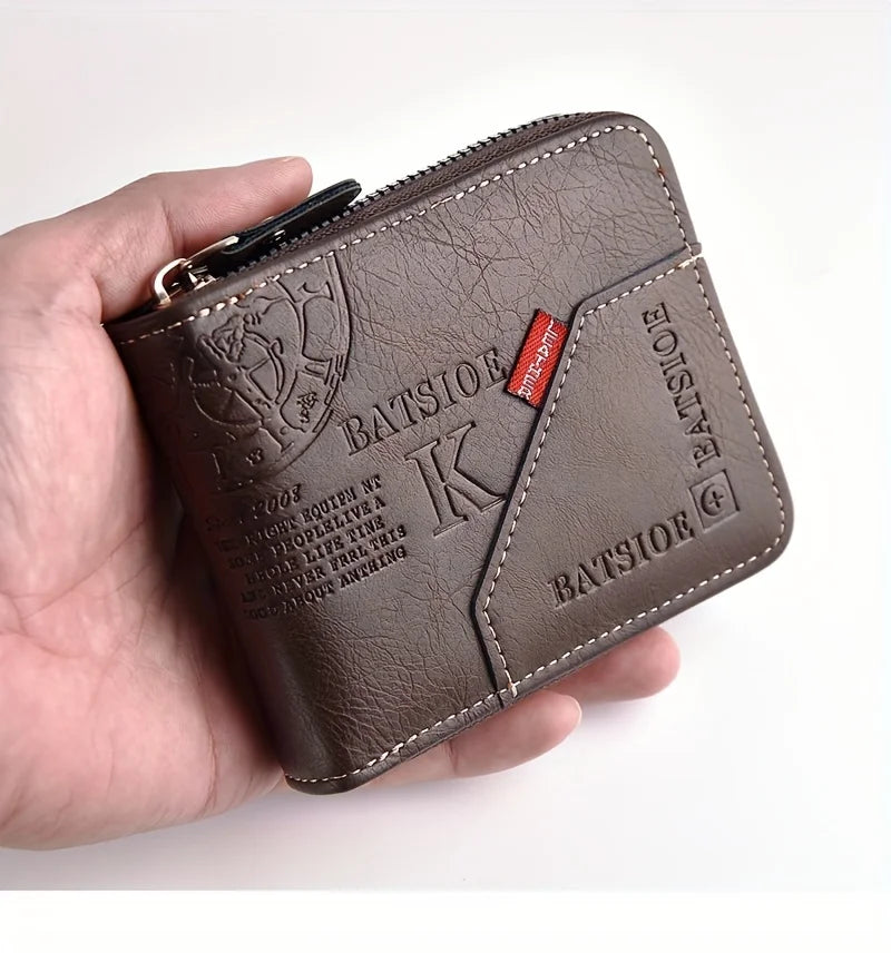 A dark brown slim PU leather wallet with a zipper closure is held in a hand.