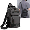 A dark gray multifunctional chest bag worn by a man, shown with a separate strap and an attached pouch.