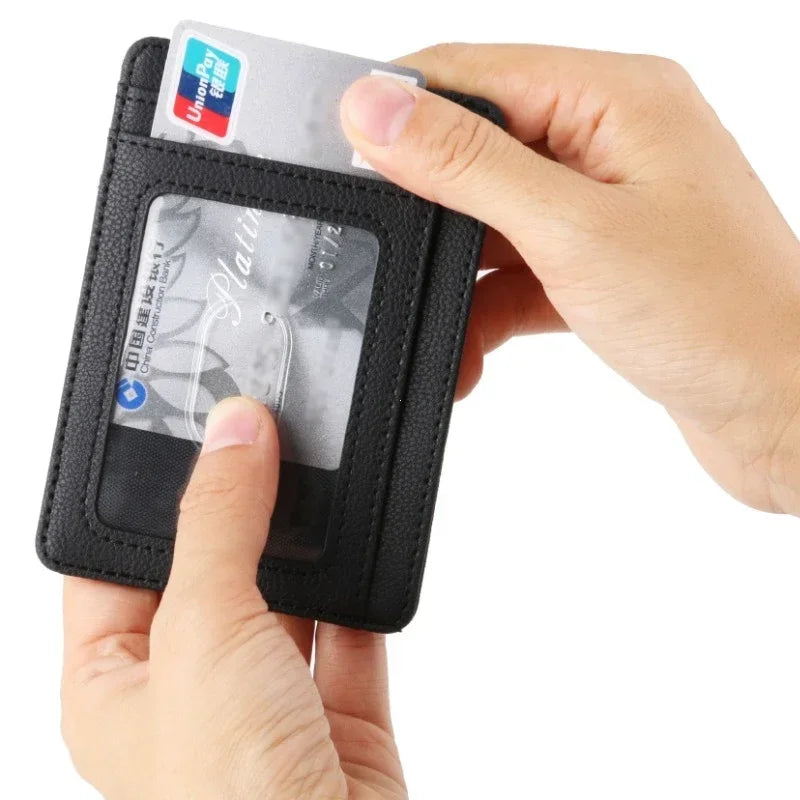 A hand holds a black slim PU leather card holder wallet with a UnionPay ID card inside.