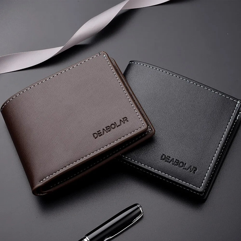 A dark brown men's PU leather folding wallet resting on a dark surface with a ribbon and a pen.
