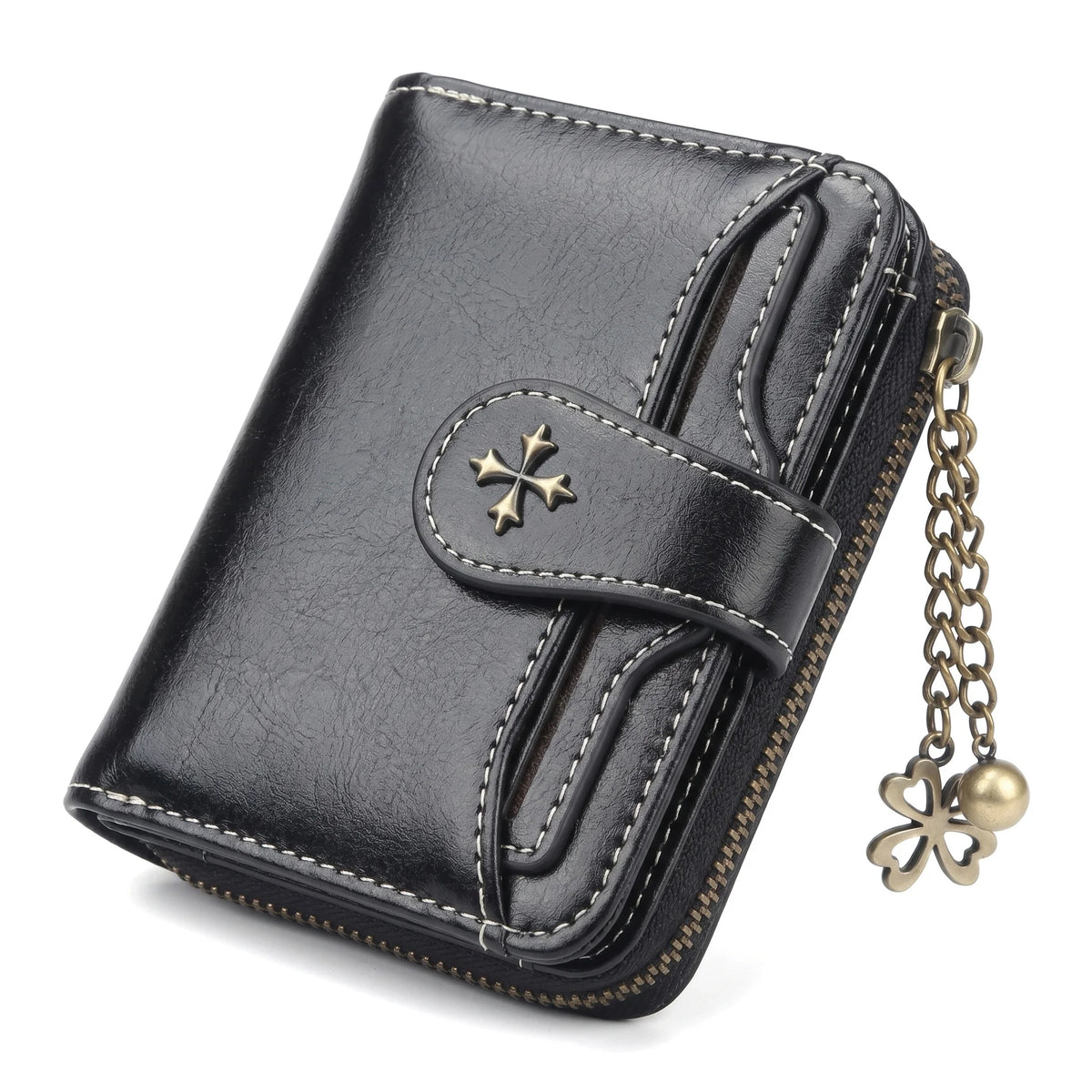 A black leather mini wallet with stitching and a gold clover charm.