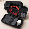 A black zippered pouch holds a red cable and a white connector for organizing cables.