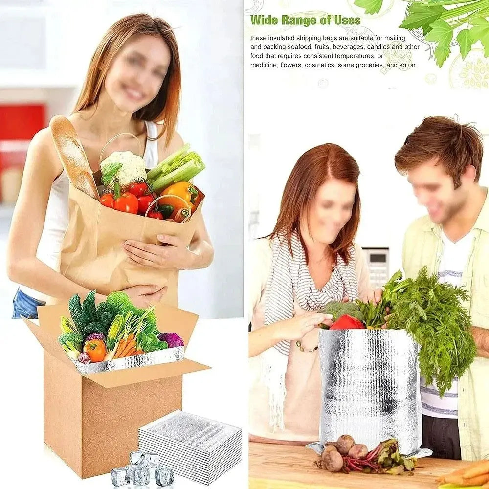 A woman holds an insulated food delivery bag filled with fresh produce and groceries.
