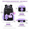 A set of three purple and black nylon school backpacks, including a backpack, a lunch bag, and a pencil case.