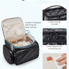 Black quilted multi-compartment travel organizer bag showing features like a grab-and-go handle and easy-to-clean PVC pocket.