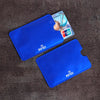Two blue RFID protection card sleeves are displayed on a dark surface next to a UnionPay card.