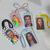 A collection of pink and white card holders with lanyards featuring portraits on a white background.