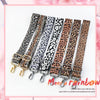 A set of five leopard print adjustable straps for bags shown in various shades of brown and black.