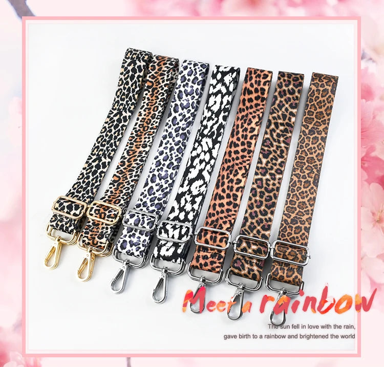 A set of five leopard print adjustable straps for bags shown in various shades of brown and black.