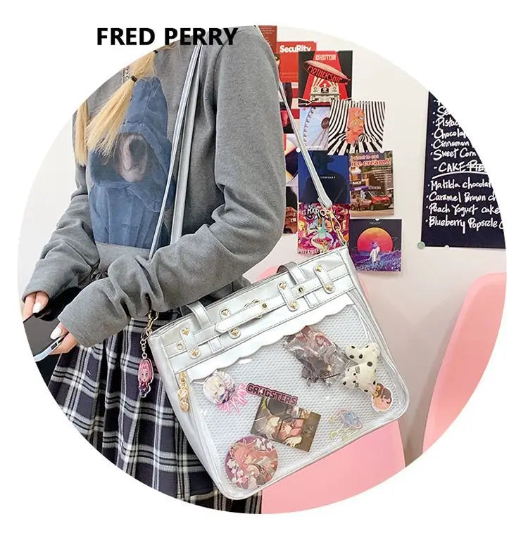 A gray hoodie-clad person holds a white Y2K punk goth crossbody bag filled with various trinkets and accessories.