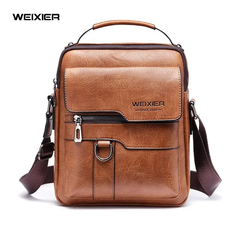 A brown vintage PU leather crossbody messenger bag with a leather handle and strap.