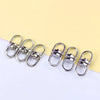 A set of silver swivel keychain hooks with secure clasps displayed on a white background.