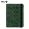 A dark green leather passport holder with a black trim and a small airplane icon.