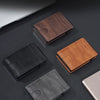 A collection of brown and black multi-functional leather wallets shown on a dark surface.