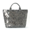 A gray tote bag with a leopard print pattern and white paint splashes.