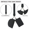 Details of a black compact wristlet wallet showing an extended wrist strap and a bimetal ring with dual zip pockets.