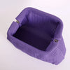 A purple knitted clip bag with a textured surface and metal clasps.