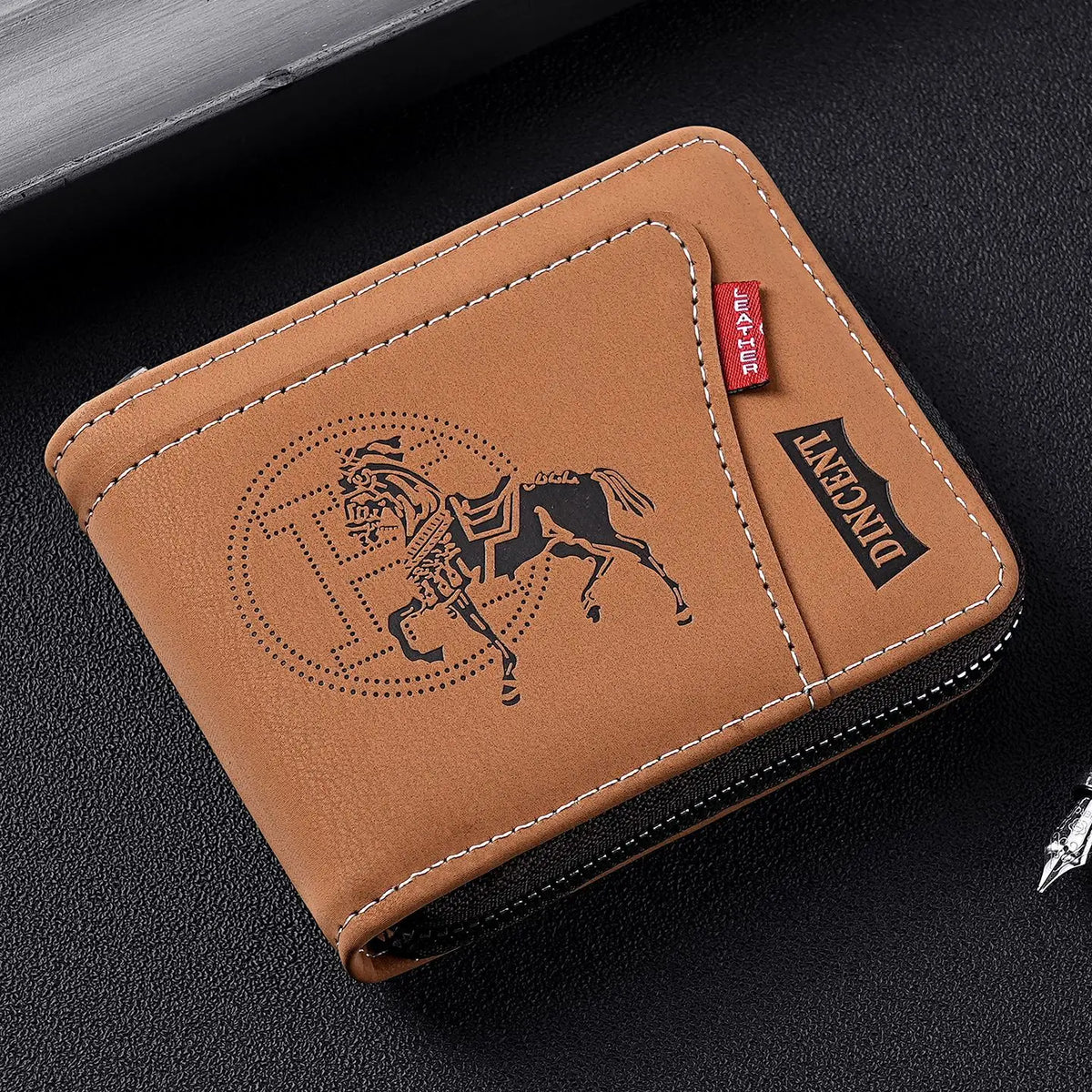A brown leather card clip wallet with a black trim and embossed silhouette of a horse.