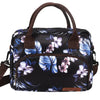Bolsa térmica portátil con estampado floral blanco y negro y correas marrones.