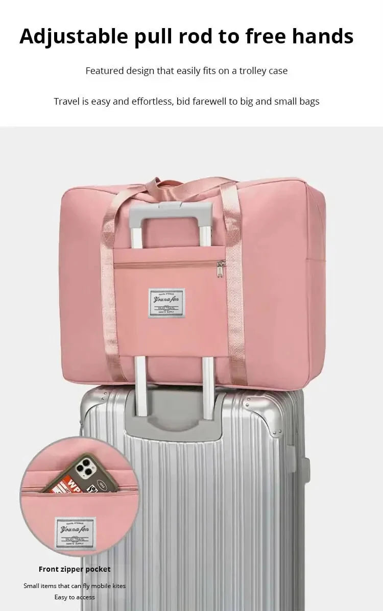 A pink canvas travel storage bag is shown resting on top of a silver suitcase.