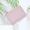 A light pink PU leather mini card holder wallet with a gold zipper, shown against a white background.