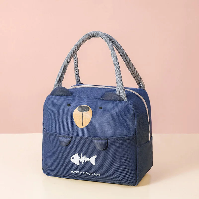A navy blue insulated thermal picnic lunch bag with gray fabric handles and a gold fish emblem.