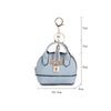Light blue portable earbud case with a gold keychain charm