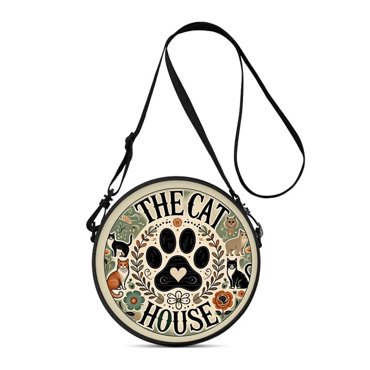 A round black crossbody bag featuring a cartoon cat silhouette design.