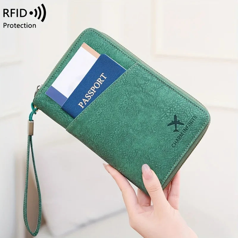 A green passport wallet with a wrist strap is shown being held by a hand, displaying a passport inside.