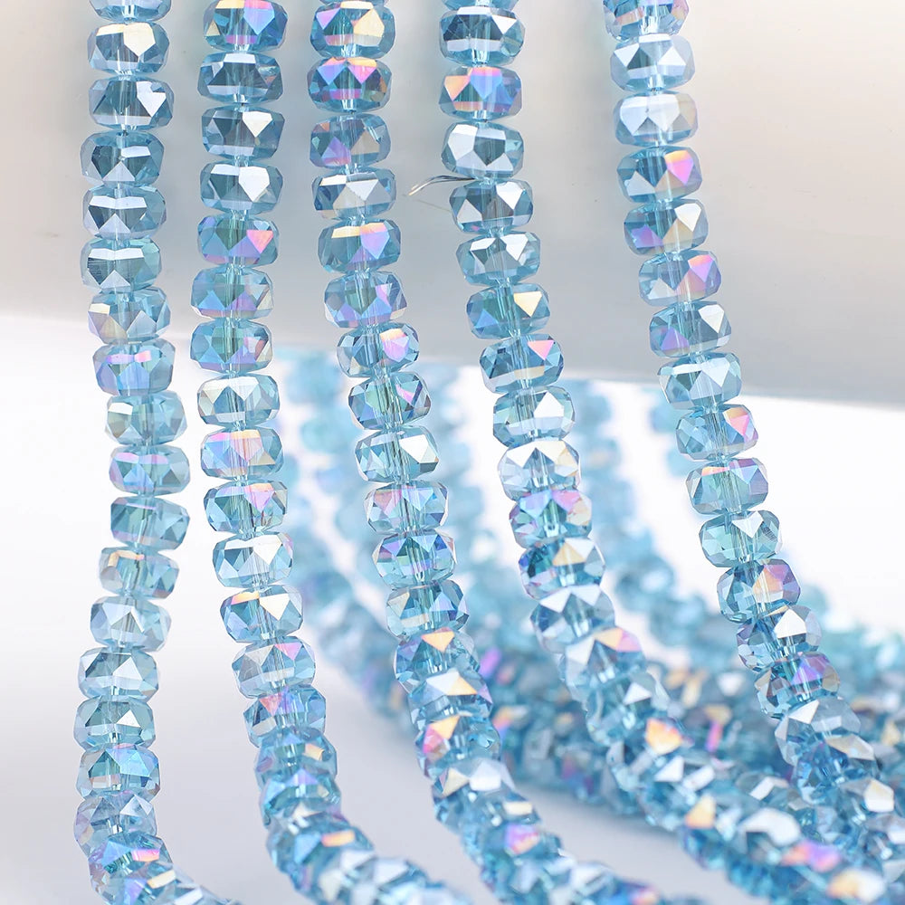 Strands of light blue AB faceted crystal glass beads in a wheel shape for jewelry making