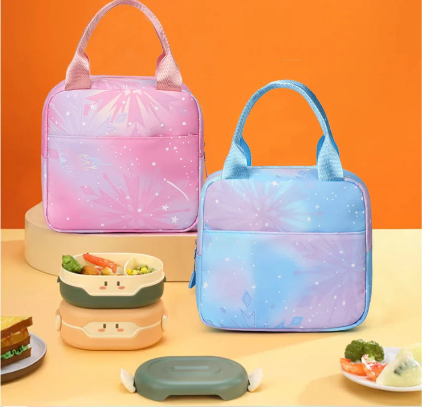 Three insulated backpacks in pink and blue colors are displayed on a light surface.