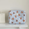 A light blue striped cosmetic makeup bag featuring a pattern of small, tan teddy bears.