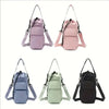 A set of four pink and black insulated water bottle crossbody bags shown from the front.