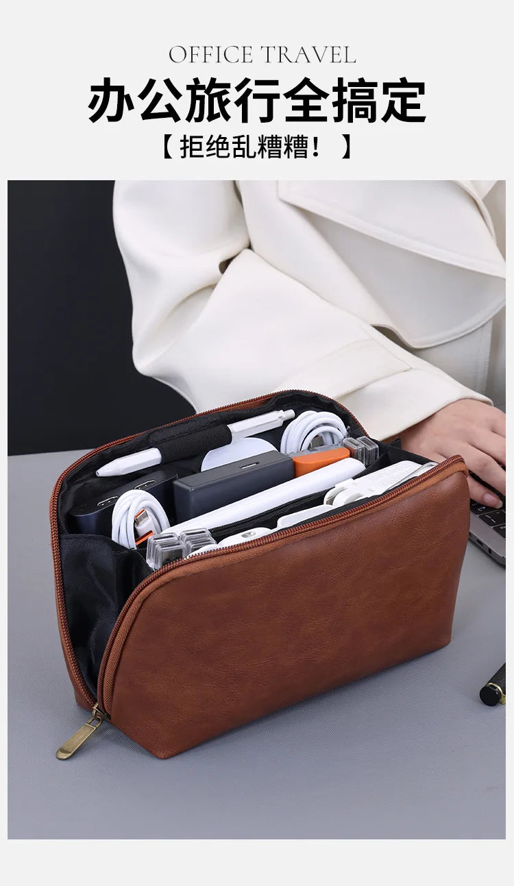 A brown leather multi-layer cable organizer pouch is shown open, displaying various electronic cables and accessories.