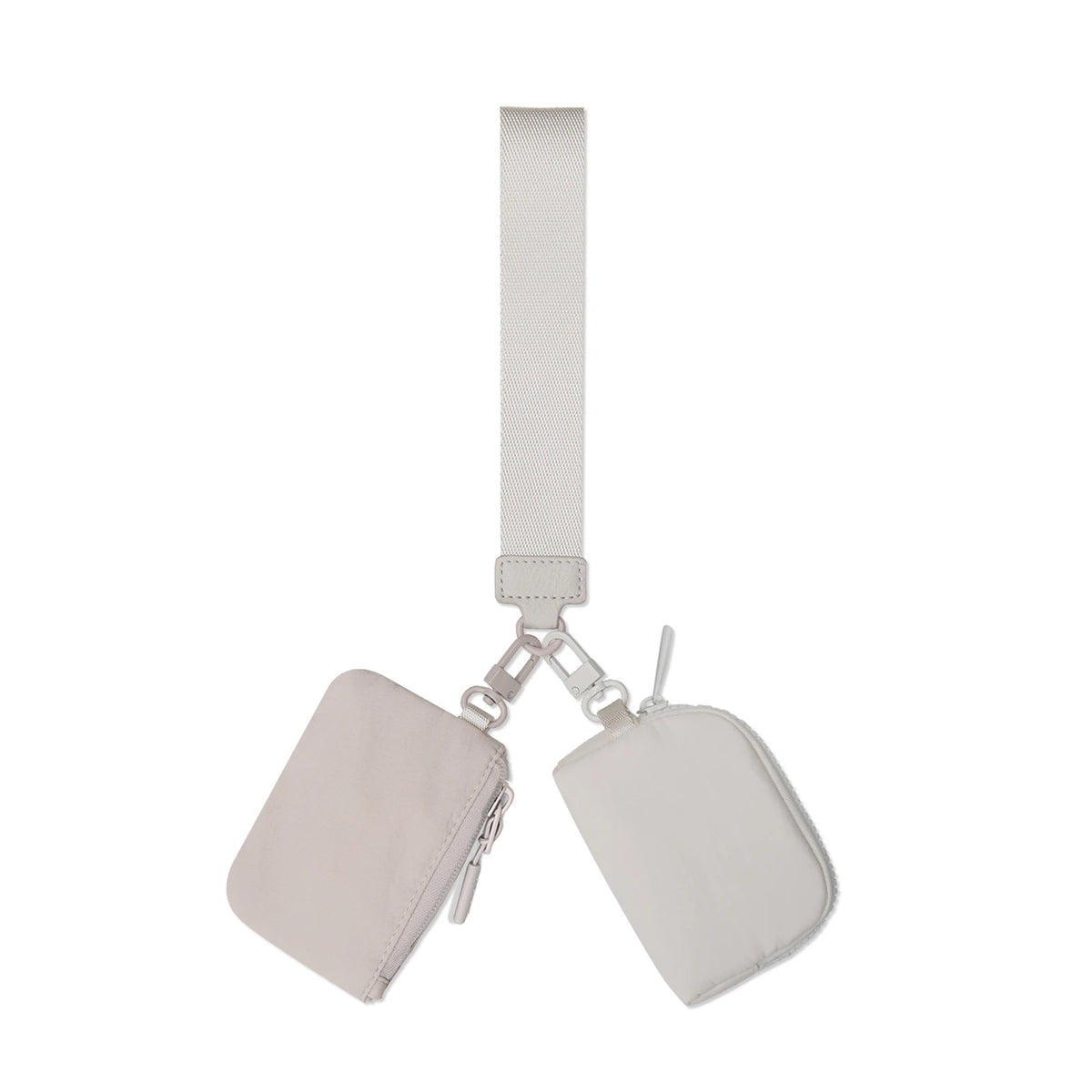A light beige nylon zipper wristlet pouch with a strap and attached to a keyring.