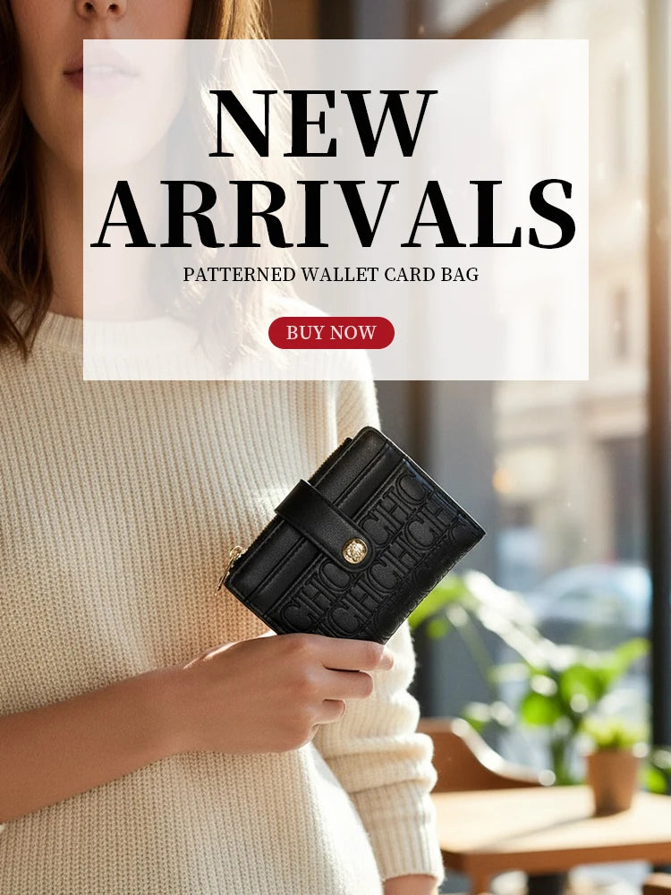 A woman holds a black patterned wallet card bag against a light beige sweater.