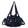 A dark navy vintage PU leather hobo shoulder bag with silver hardware.