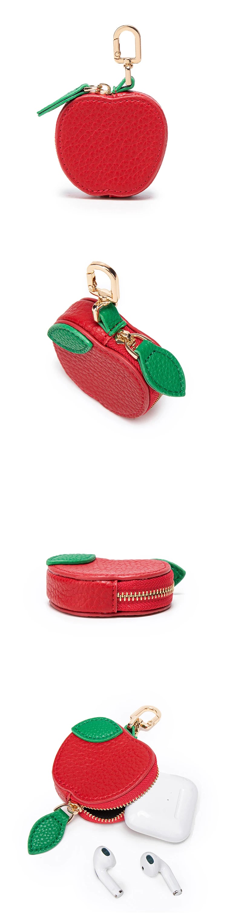 Red apple shaped coin purse keychain with green accents and white earbuds.