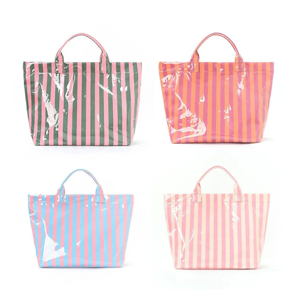 Three striped tote bags in shades of green, pink, and blue are displayed side by side.