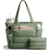 A quilted olive green puffer tote bag with pockets and a matching pouch resting on a white surface.