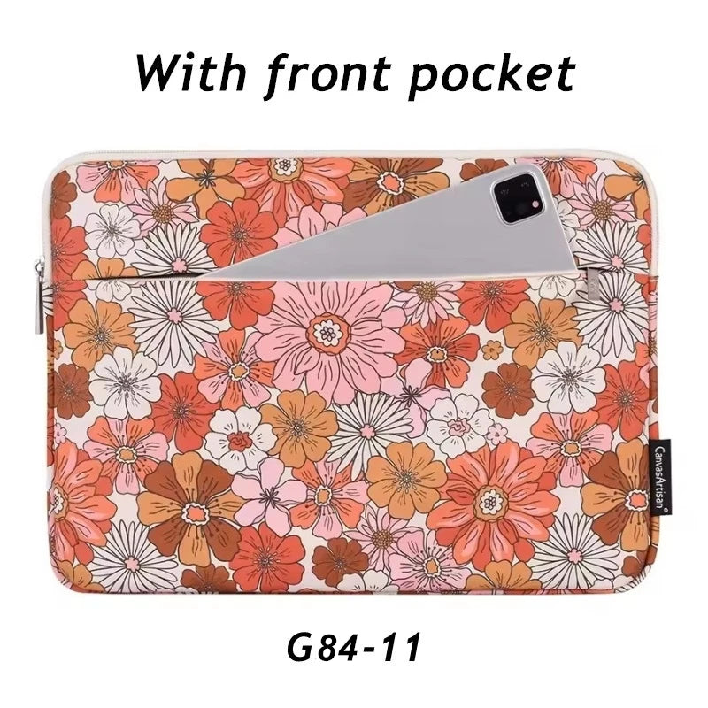 A floral patterned laptop sleeve with a front pocket for a smartphone.