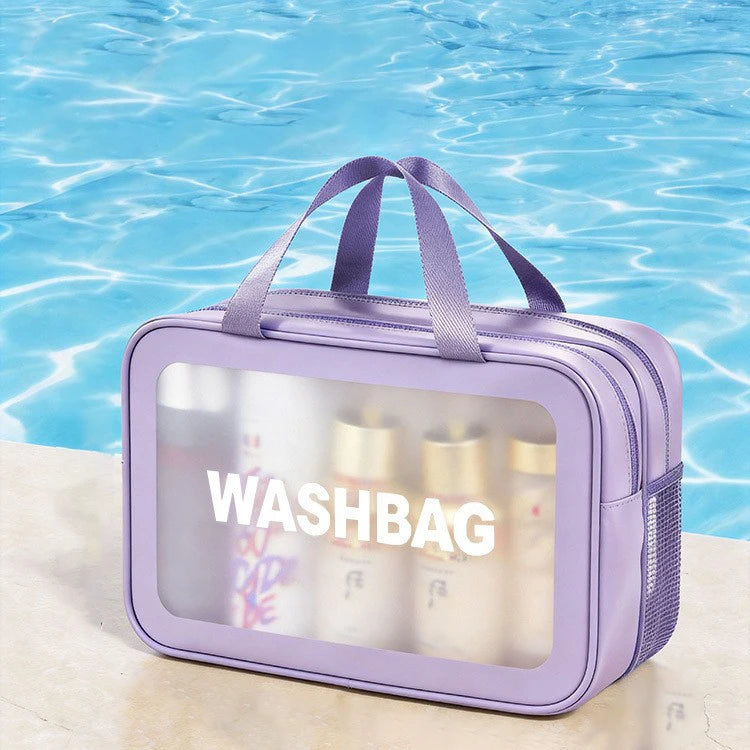 A purple plastic washbag with a clear window is shown floating on blue water.