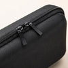 Black durable waterproof cable organizer pouch with a zippered compartment