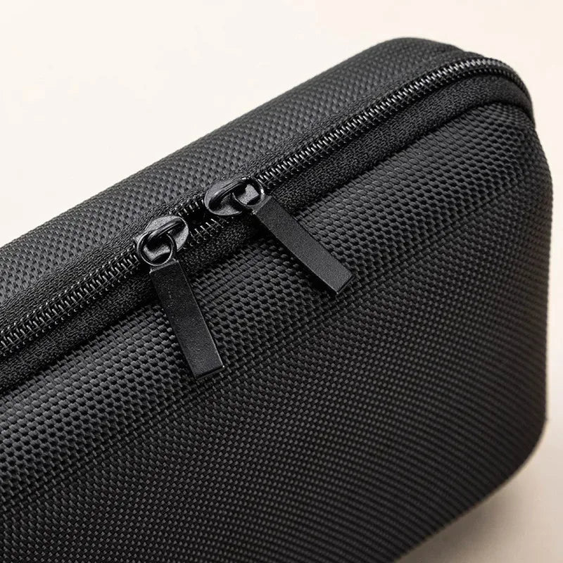 Black durable waterproof cable organizer pouch with a zippered compartment