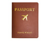 A brown PU leather passport wallet featuring gold embossed text and a golden airplane icon.