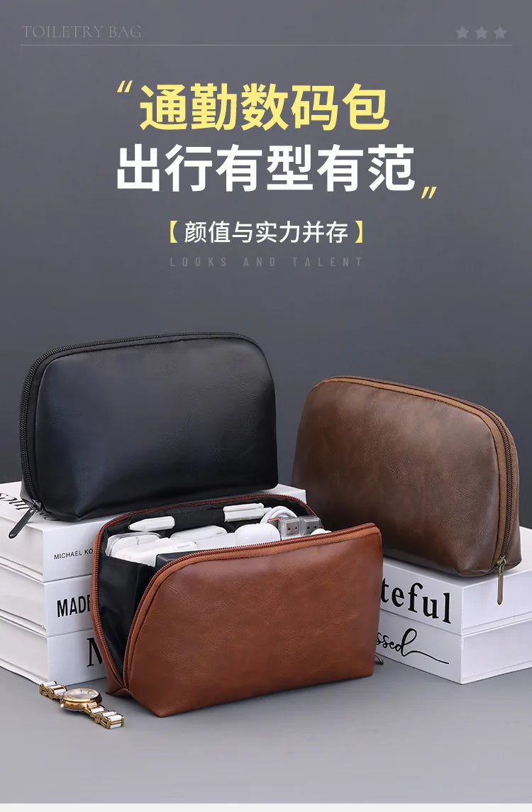 A brown leather multi-layer cable organizer pouch is displayed next to a black version on a stack of white books.
